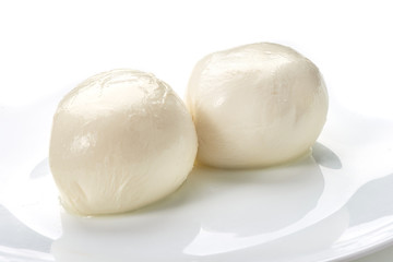 Fototapeta na wymiar Mozzarella cheese, close-up, isolated on white background.