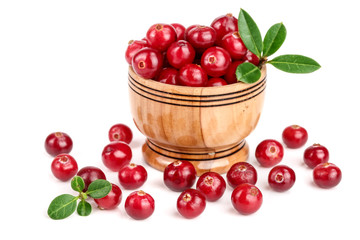 Cranberry with leaf in wooden bowl isolated on white background closeup