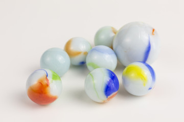 glass marbles in white with blue and red