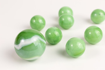 group of glass marbles in green