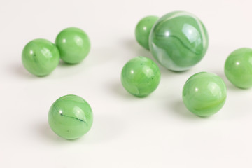 group of glass marbles in green