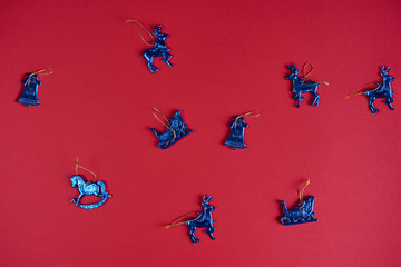 Blue christmas decoration on red background. Design mockup