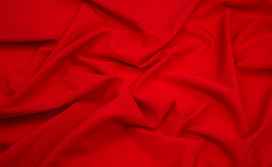 bright red fabric lined with soft folds, artificial silk