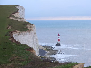 White Chalk cliffs and Lighthouse at ocean coastline in England