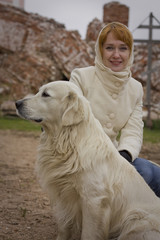 Girl and a white Labrador.
