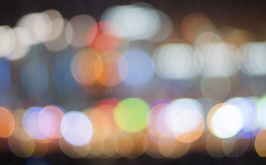 Fototapeta premium Dark blurred background of night city lights