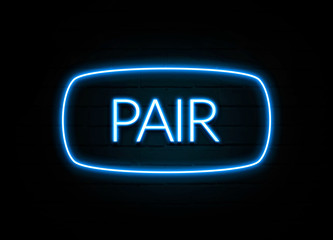 Pair  - colorful Neon Sign on brickwall