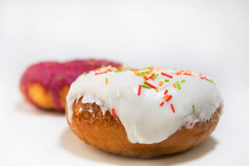 two donuts covered with icing