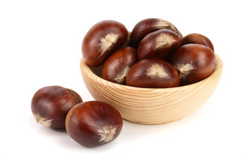 chestnut in a wooden bowl isolated on white background. Top view