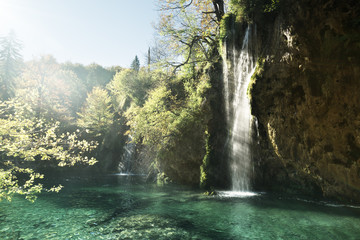waterfall in forest, Plitvice Lakes, Croatia © Iakov Kalinin