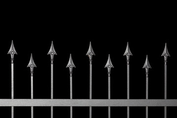 metal 
 lattice with sharp tips on a black background