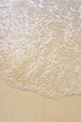 Fine sandy beach and water closeup