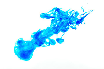 Splash of blue paint in water