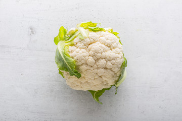 Top of view  fresh cauliflower on white concrete background