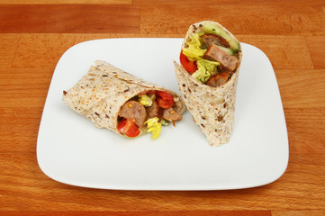 Sausage and salad wraps on a tabletop