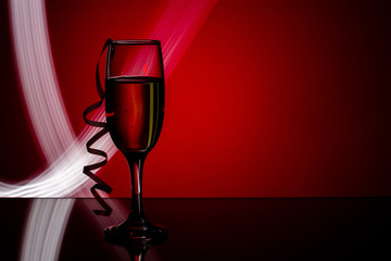  glass of champagne on  red background. 