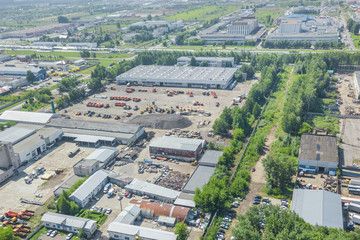 Top view of the industrial buildings and parking of special equipment