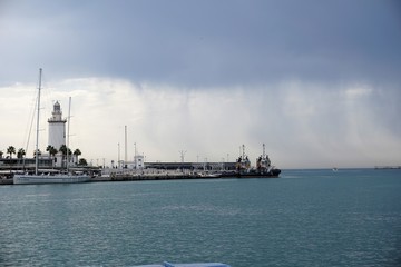 Lighthouse in rainy sky