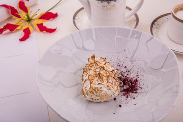 Dessert Iceberg. Three types of ice cream. Raspberry, blackcurrant and camomile ice cream, is served with the ground bilberry and blackcurrant, in bilberry sauce