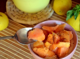 Healthy breakfast ripe chopped papaya with cottage cheese on a bowl on a wooden table.    