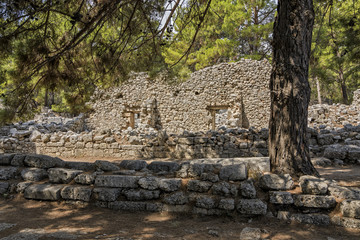 Stone ruins of houses and the street of the ancient city of Phaselis.