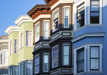 Row of colorful buildings with bay windows architecture in San Francisco, California