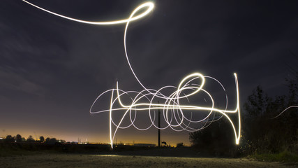 Drawing with light at night - obrazy, fototapety, plakaty