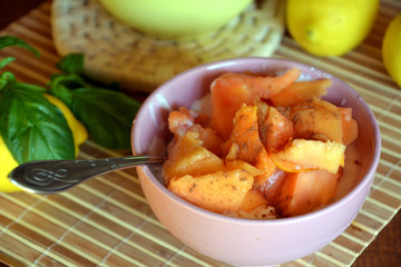 Healthy breakfast ripe chopped papaya with cottage cheese on a bowl on a wooden table.    