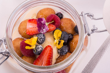 Cottage cheese donuts from goat cottage cheese with strawberry, bilberry, raspberry with truffle oil
