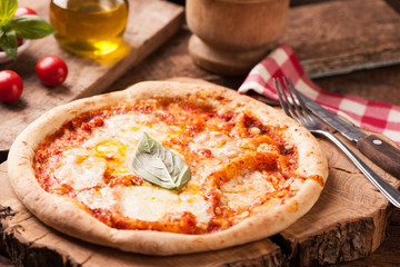 Margherita Italian Pizza on wooden table