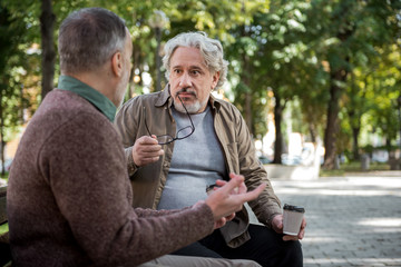 Mature male friends talking outdoor