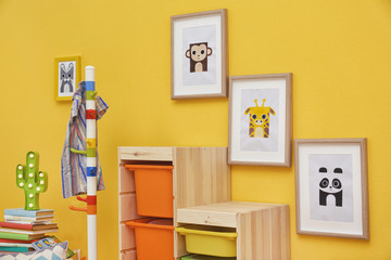 Fototapeta premium Baby room with pictures of animals on wall