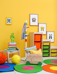 Baby room with pictures of animals on wall