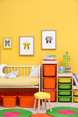 Baby bedroom with pictures of animals on wall