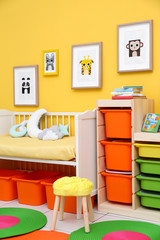 Baby bedroom with pictures of animals on wall