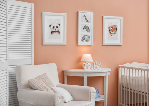 Baby room with pictures of animals on wall
