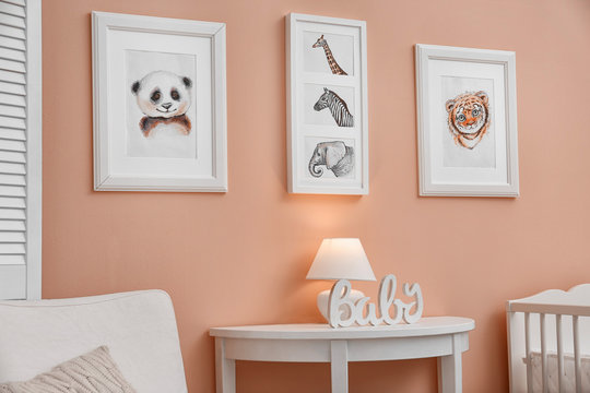 Baby room with pictures of animals on wall