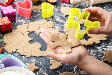 Baking christmas cookies on grey wooden table