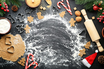 Baking christmas cookies on grey wooden table