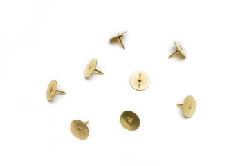 Small Collection Of 4 Brass Thumbtacks On White Background