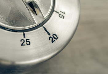 20 Minutes - Macro Of An Analog Chrome Kitchen Timer On Wooden Table