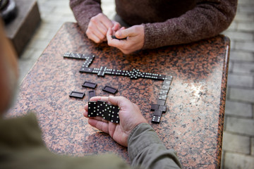 Senior men playing domino outdoor