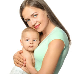 Happy young woman with cute baby on white background