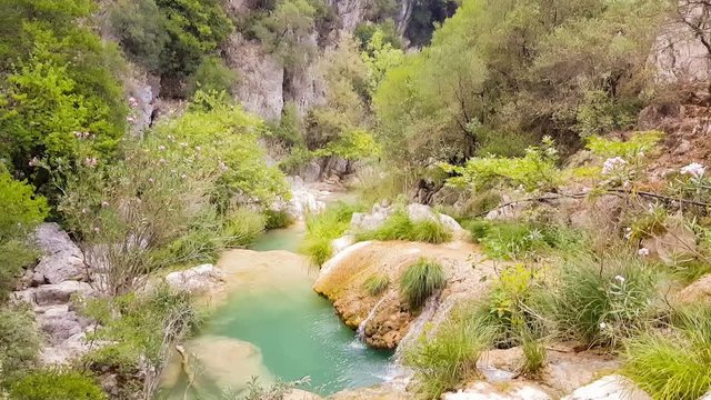 Landscape at Polilimnio in Greece with a pond in the nature.