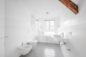 Fototapeta na wymiar white bathroom - modern tiled bath bathtub 