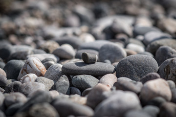 Pebbles. Trapezoidal, oval stone on the other