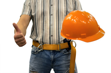 Builder construction worker in mounting belt and with helmet in hand showing thumbs up gesture sign isolated on white background. Construction background. Repair concept. Work safety.