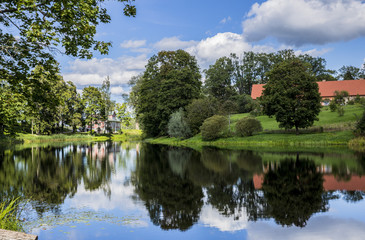 Fototapeta premium park, green, river, trees, lake, latvia, house, castle, summer, clouds, blue, sky, water, traveling, nature, europe, landscape