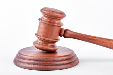 Judge gavel with wooden stand. Classic wooden gavel with stand on white background. Law, business,...