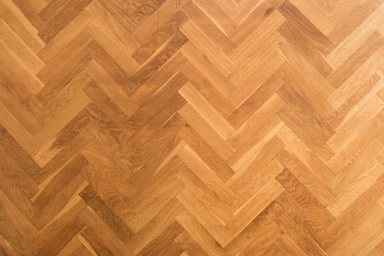 wooden floor background - herringbone parquet background